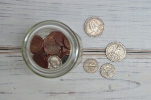 Picture of coins in a jar.